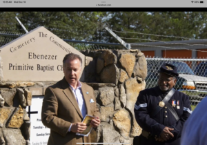 Rep. Mike Sparks and Dr. George Smith speak about the importance of history. Sparks talks about the hymn ‘Amazing Grace’ just minutes after the song was sung by the crowd. The hymn was written by John Newton who fought tirelessly to end slavery in Great Britain. Newton was a former slave ship captain.